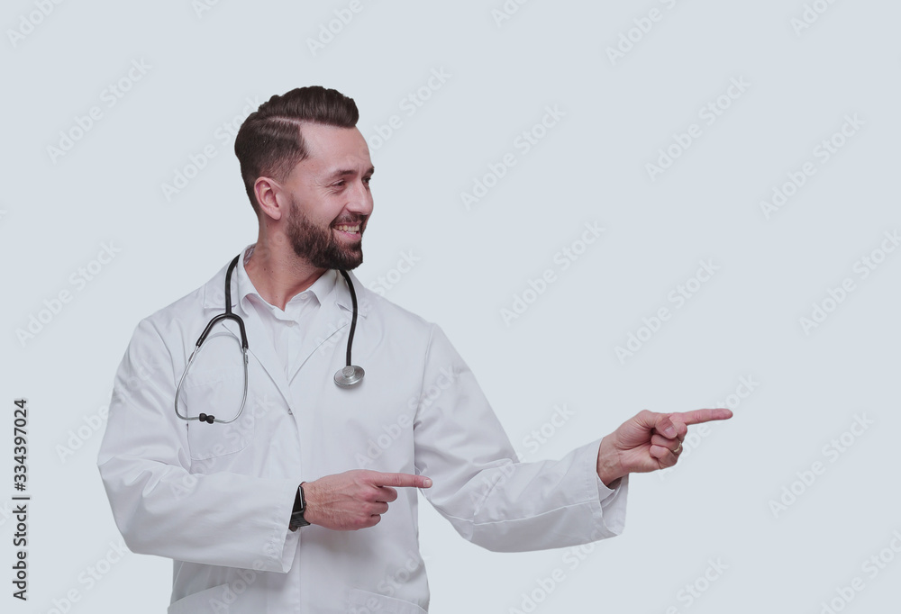 in full growth. smiling therapist doctor pointing to copy space in full growth. smiling therapist doctor pointing to copy space