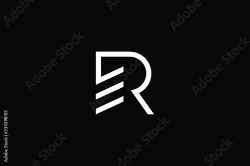 Logo design of R RE ER in vector for construction, home, real estate, building, property. Minimal awesome trendy professional logo design template on black background. photo