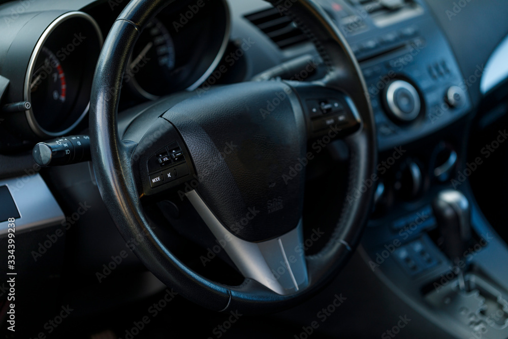 Close up view of the interior of a modern automobile showing the dashboard.