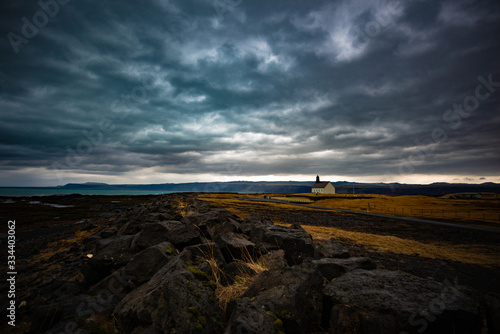 small church in an Icelandic landscape with moody clouds