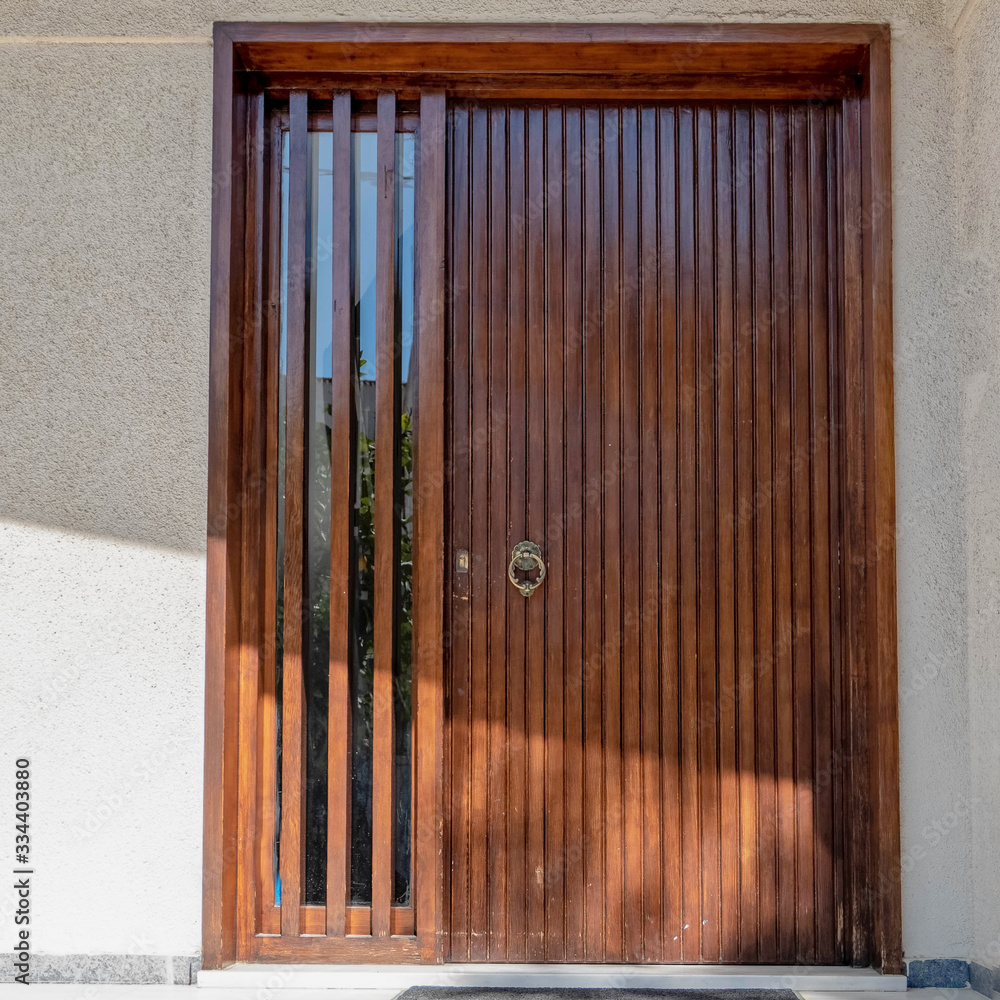house entrance natural wood and glass door