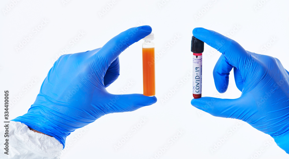 Coronavirus, Doctor holding positive covid-19 virus Blood Sample tube white background Coronavirus, Doctor holding positive covid-19 virus Blood Sample tube white background