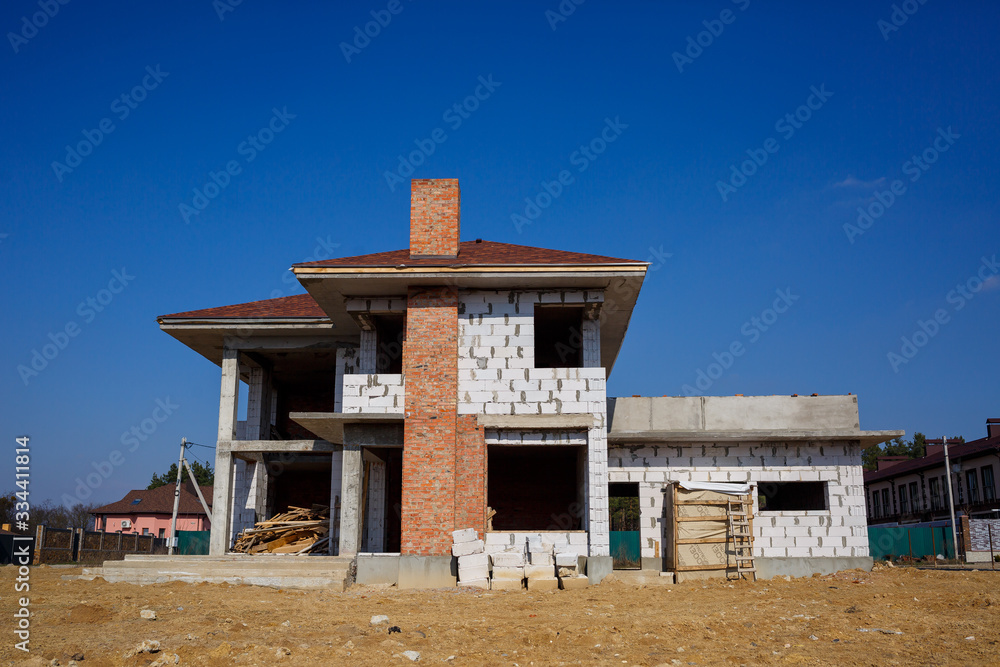 construction of a country two-story house from a gas block
