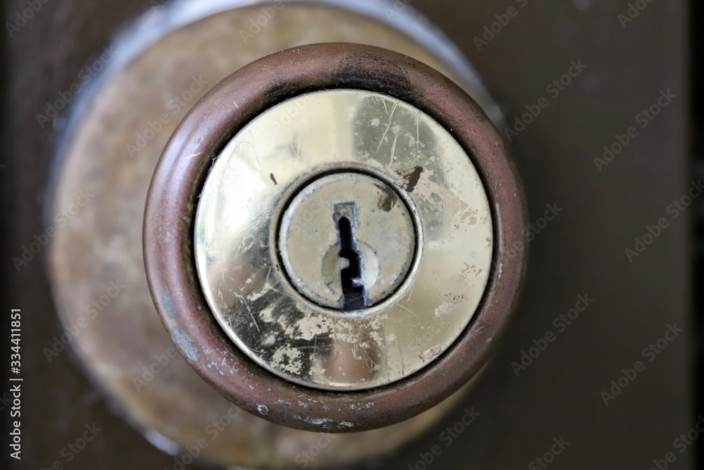 Closeup of weathered door lock with keyhole