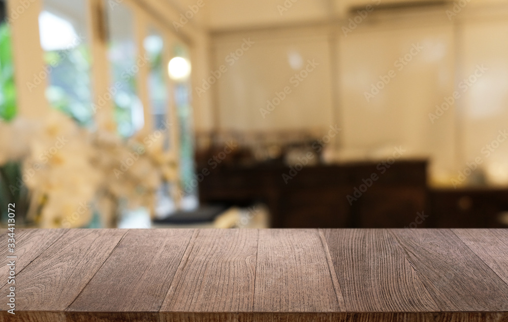 Empty dark wooden table in front of abstract blurred bokeh background of restaurant . can be used for display or montage your products.Mock up for space. Empty dark wooden table in front of abstract blurred bokeh background of restaurant . can be used for display or montage your products.Mock up for space.