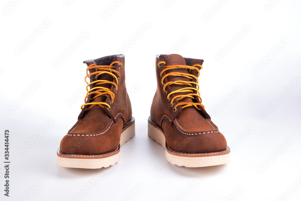 Brown boot on white background. Brown boot on white background.