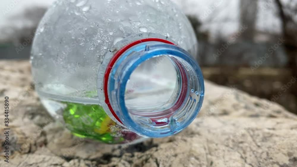Empty used plastic bottle discarded in the park. Empty used plastic bottle discarded in the park.