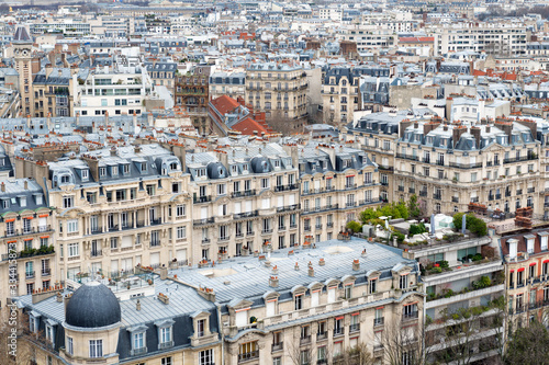 Aerial view of haussmanian buikdings roofs of the city of Paris, France.