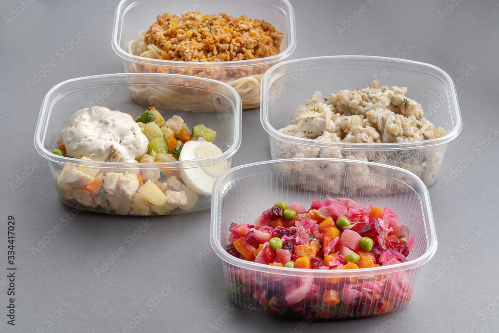 Jar with Venegret in the foreground. Pasta with minced meat and onion in navy-style and a jar of vinaigrette on a gray background-2. Jar with Venegret in the foreground. Pasta with minced meat and onion in navy-style and a jar of vinaigrette on a gray background-2.
