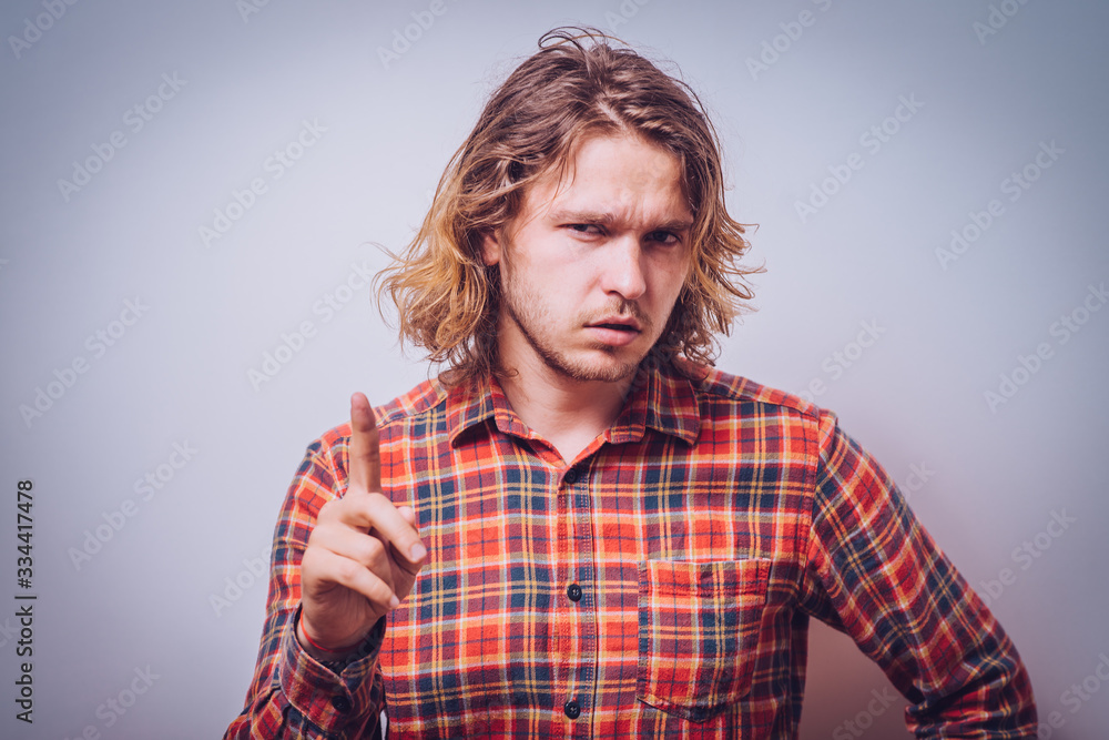 pointing up with his index finger pointing up with his index finger