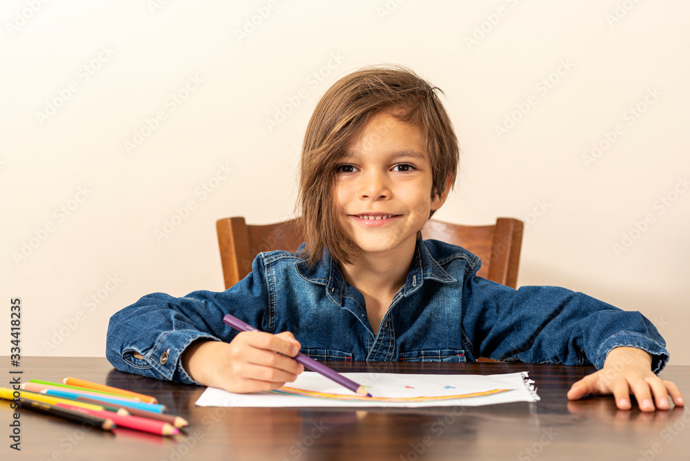 little boy is drawing a rainbow picture little boy is drawing a rainbow picture