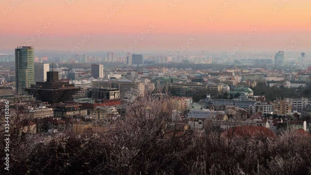 Wide panning shot of Bratislava cityscape and Bratislava Castle during colorful sunset, Slovakia Wide panning shot of Bratislava cityscape and Bratislava Castle during colorful sunset, Slovakia