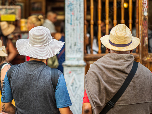 two persons in straw hats photo