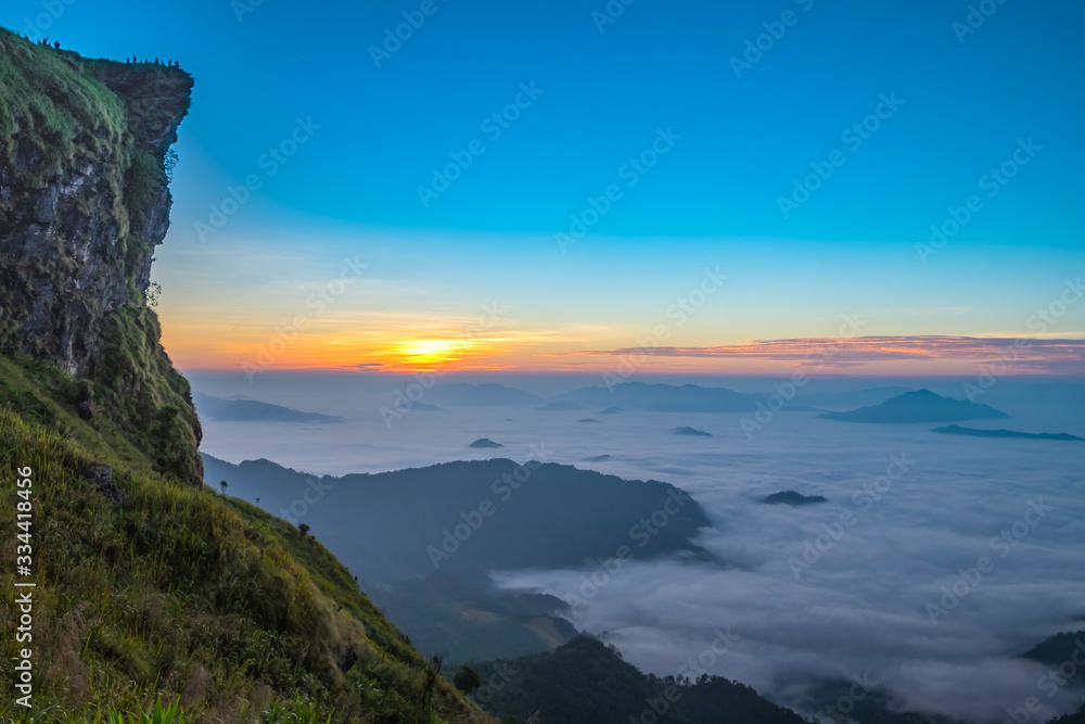 Fototapeta premium Morning sunrise with fog on Phu Chee Fah in Chiang Rai, Thailand.