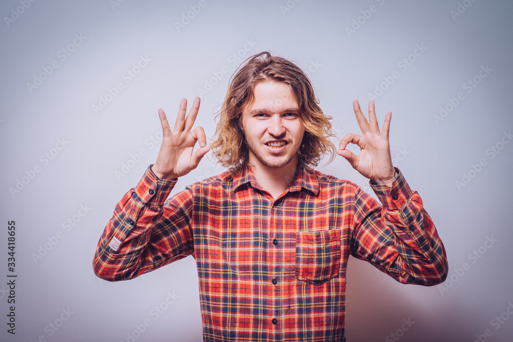 man shows that everything is fine, do not worry. all okay. Gesture. Close portrait. man shows that everything is fine, do not worry. all okay. Gesture. Close portrait.