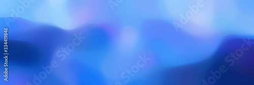 unfocused bokeh horizontal header background with corn flower blue, royal blue and light sky blue colors space for text or image