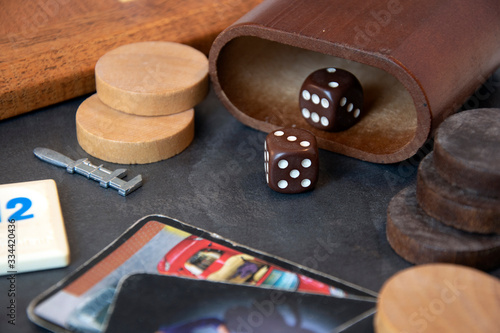 Variety of board game pieces, black background