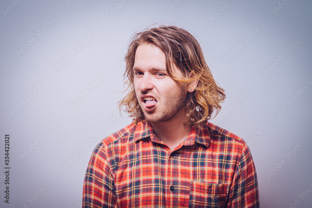 Man shows tongue Man shows tongue