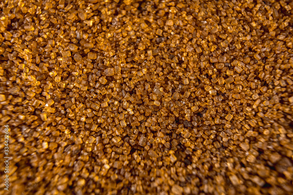 Detail of texture of beautiful brown sugar grains, macro photography Detail of texture of beautiful brown sugar grains, macro photography