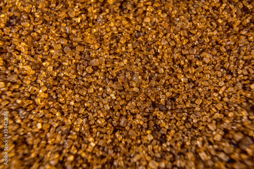 Detail of texture of beautiful brown sugar grains, macro photography
