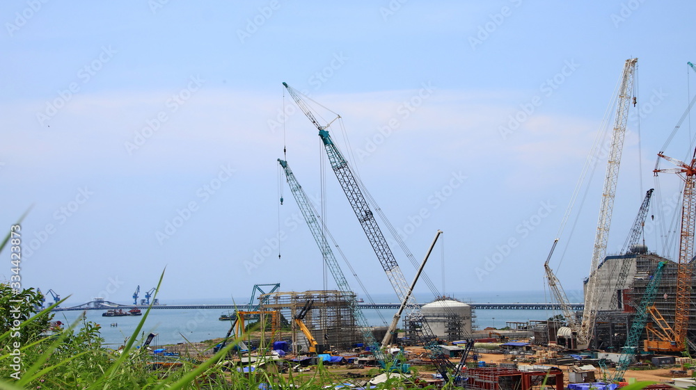 Unfocused, Blurry selective focus image the atmosphere in the steam power plant development project, Batang Indonesia Unfocused, Blurry selective focus image the atmosphere in the steam power plant development project, Batang Indonesia