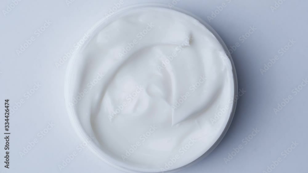 Close up shot of cosmetics cream with rotate, Top view Close up shot of cosmetics cream with rotate, Top view