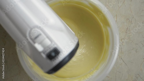 Close-up of a mixer making cream for preparing delicious home-made baking