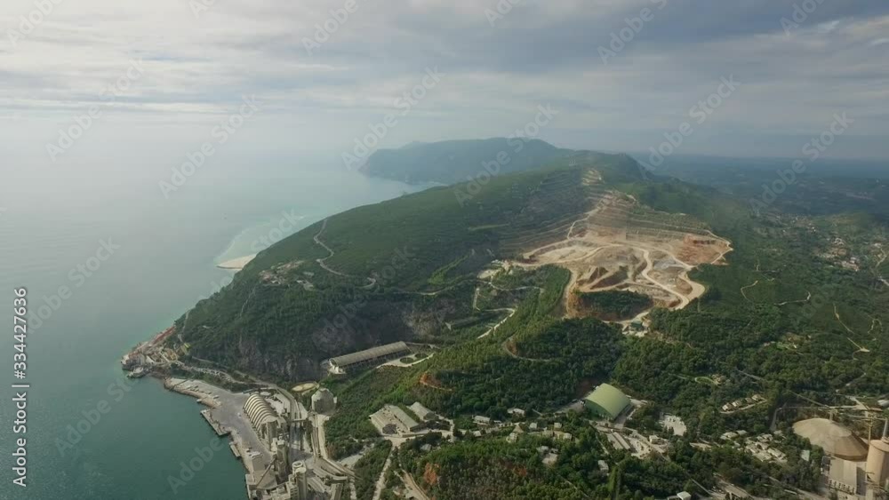 Nature devastation. Quarry on a beautiful island mountain. Drone shot. Nature devastation. Quarry on a beautiful island mountain. Drone shot.