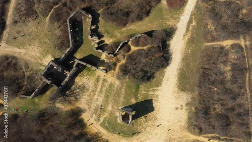 Drone footage from old castle ruins in Pilisborojeno, Hungary
Camera looks down and circles photo