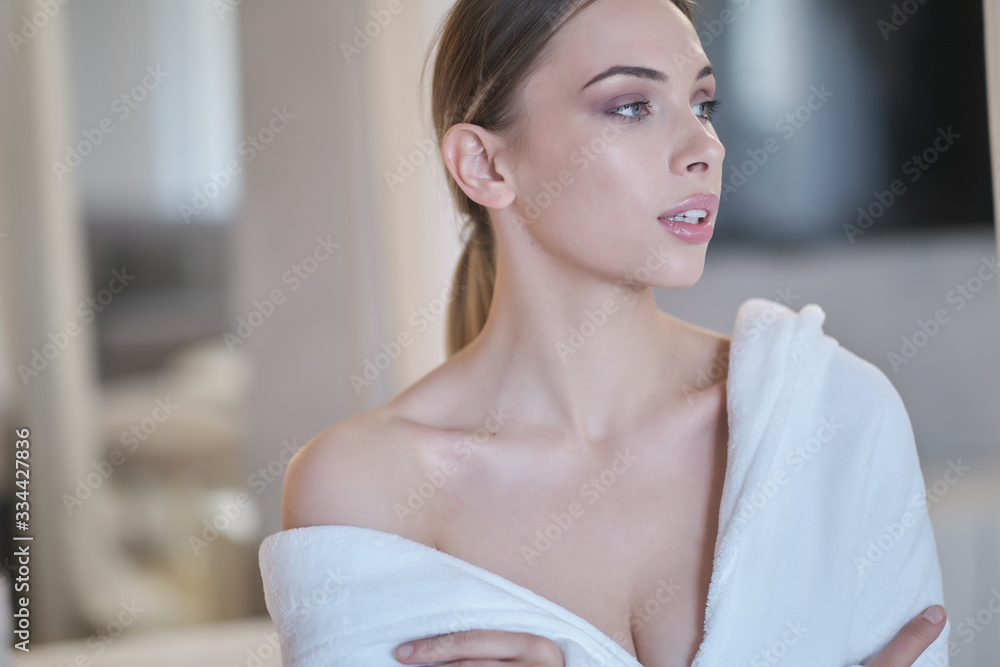 woman resting in a bathrobe at home woman resting in a bathrobe at home