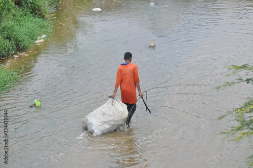recycled item collector activity at the river