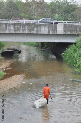 recycled item collector activity at the river
