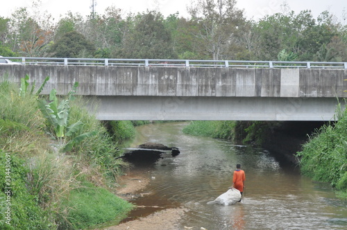 recycled item collector activity at the river