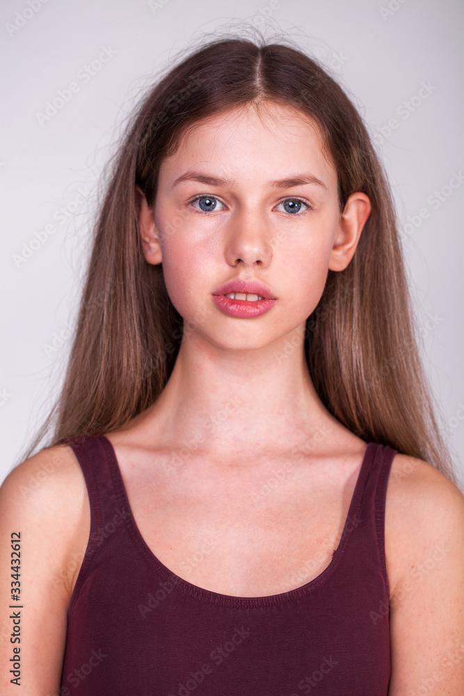 Fototapeta premium Close up portrait of a young beautiful woman