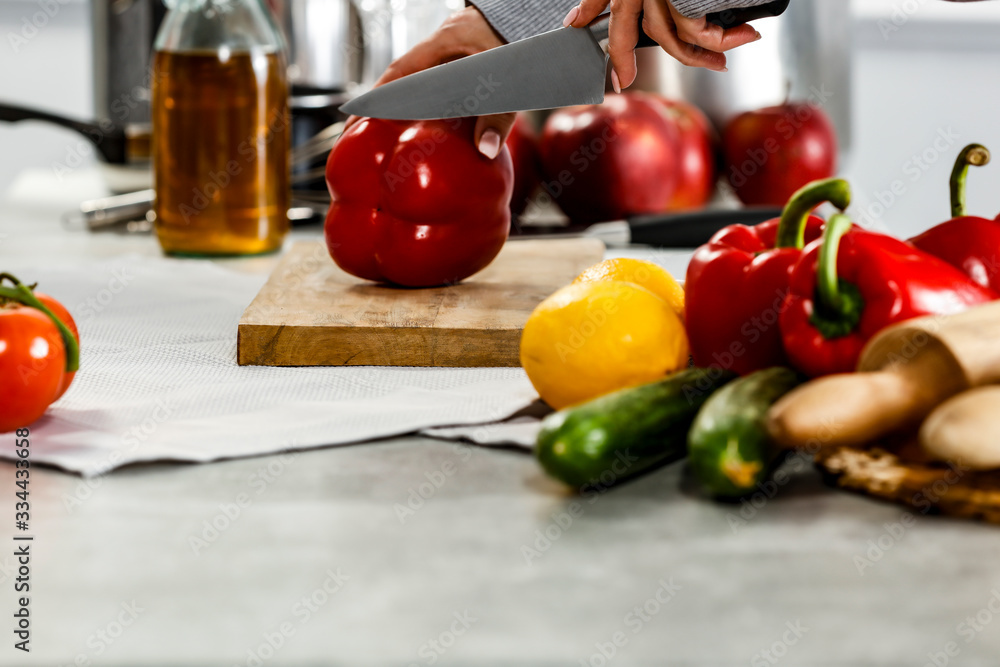 Kitchen background and hands with vegetables Kitchen background and hands with vegetables