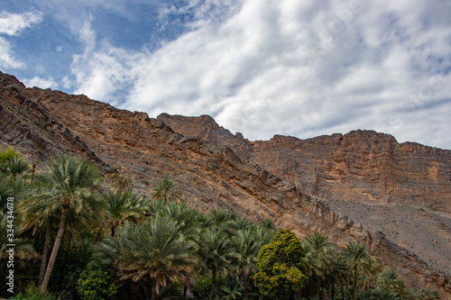 Mountain and valley view along Wadi Sahtan road and snake canyon in Al Hajir mountains between Nizwa and Mascat in Oman photo