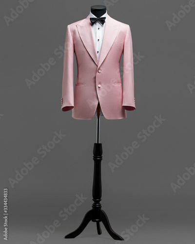 Atelier to repair clothes, Stylish look, Fashion look, Men look, Wedding style, Fashion concept, Brand clothing, Classic costume,Suit on grey background. Store display. Classic style.