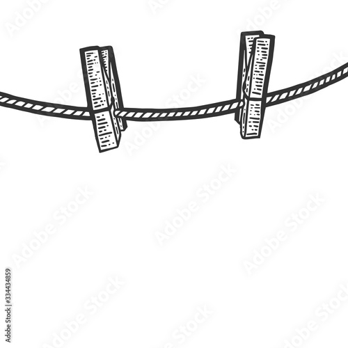 Clothesline and two wooden clothespins. Engraving vector illustration