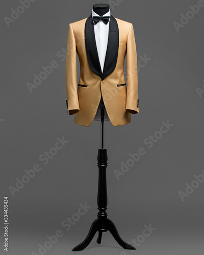 Atelier to repair clothes, Stylish look, Fashion look, Men look, Wedding style, Fashion concept, Brand clothing, Classic costume,Suit on grey background. Store display. Classic style.