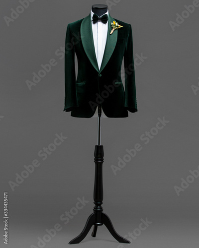 Atelier to repair clothes, Stylish look, Fashion look, Men look, Wedding style, Fashion concept, Brand clothing, Classic costume,Suit on grey background. Store display. Classic style.