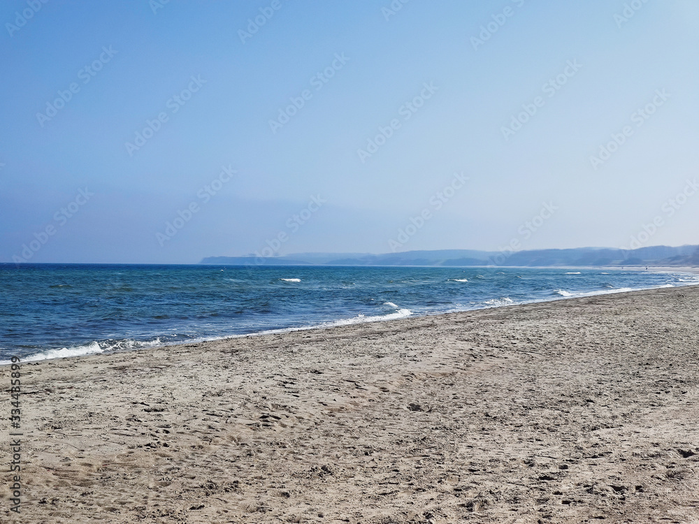 Beautiful sea scene in Germany with white sand on foreground Beautiful sea scene in Germany with white sand on foreground