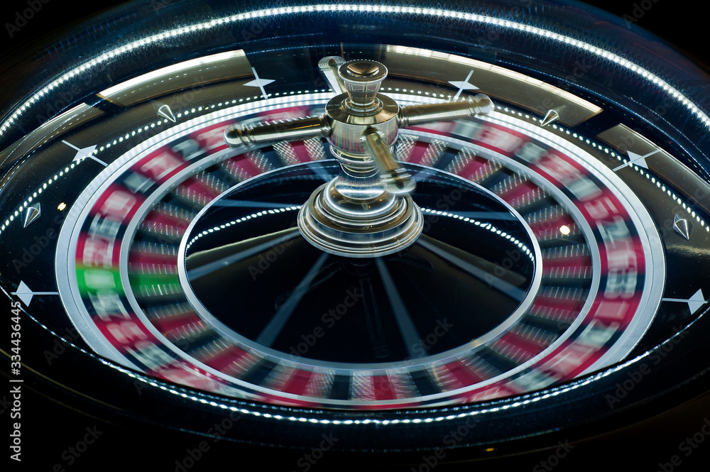 Casino background. Luxury Casino roulette wheel on black background. Casino theme. Close-up black casino roulette with a ball Casino background. Luxury Casino roulette wheel on black background. Casino theme. Close-up black casino roulette with a ball