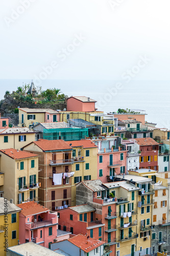 Nice aerial landscape view of the little town of Manarola in the Cinque Terre in Liguria Italy. It is a small colorful village perched on the rocks with a fantastic view of the Mediterranean sea
