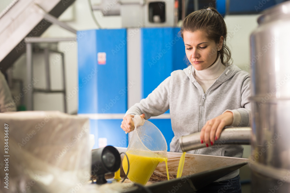 Workwoman controlling quality of olive Workwoman controlling quality of olive