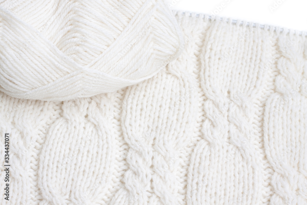 Cables knit stitch pattern, handmade knitted clothes texture, knitting needles and yarn, decorative design for cardigans and sweaters. Hobby and leisure time motif Cables knit stitch pattern, handmade knitted clothes texture, knitting needles and yarn, decorative design for cardigans and sweaters. Hobby and leisure time motif