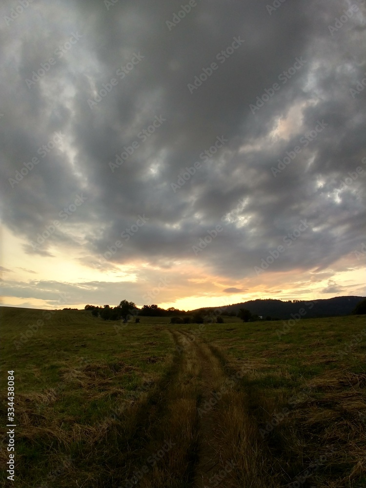 Fototapeta premium Sunrise or sunset over the hills and meadow. Slovakia
