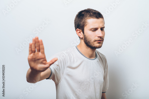 Businessman shows stop gesture © aeroking