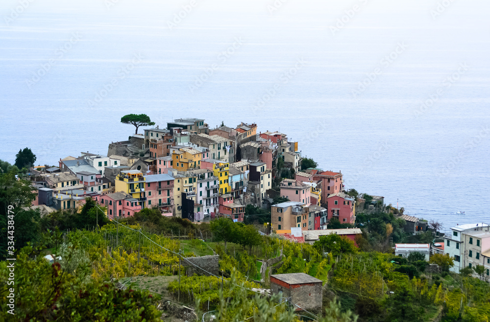 Nice aerial landscape view of the little town of Corniglia in the Cinque Terre in Liguria Italy. It is a small colorful village perched on the rocks with a fantastic view of the Mediterranean sea