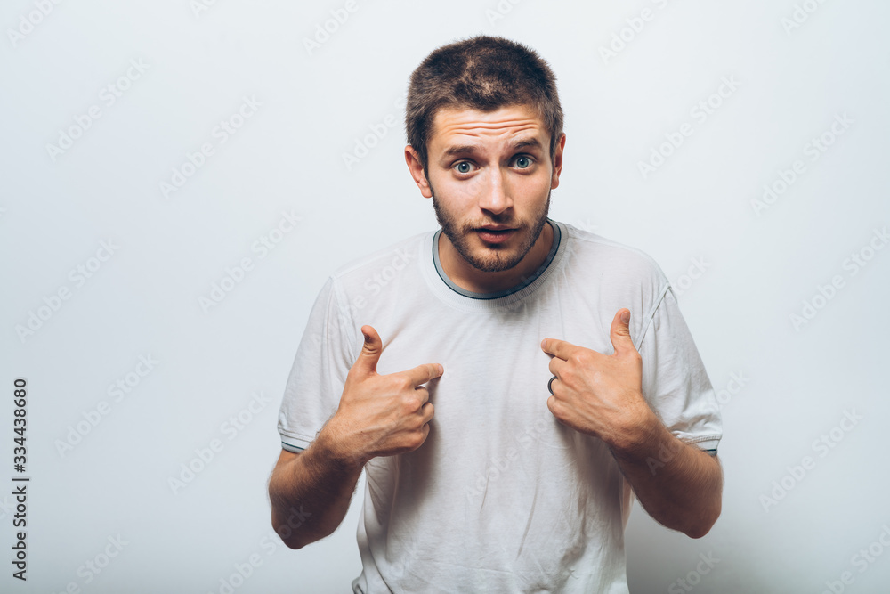 Male hand forefinger pointing to himself on the chest. Gesture. who am i. On a gray background Male hand forefinger pointing to himself on the chest. Gesture. who am i. On a gray background
