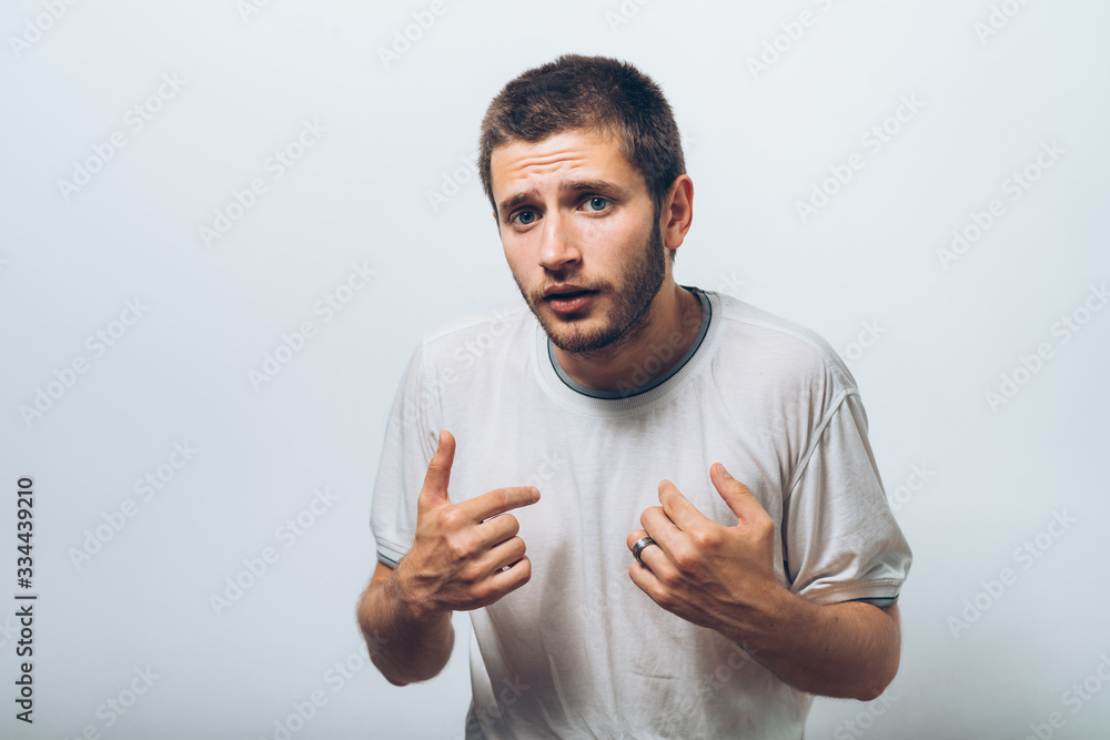 Male hand forefinger pointing to himself on the chest. Gesture. who am i. On a gray background Male hand forefinger pointing to himself on the chest. Gesture. who am i. On a gray background